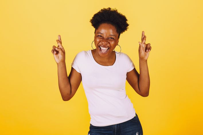 Woman in White Shirt Smiling Widely